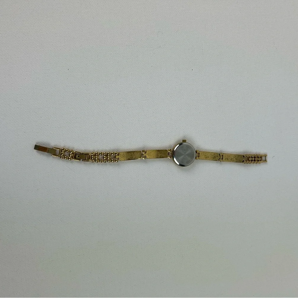 Elegant Avon Gold Tone Watch with Yellow Accents, 1